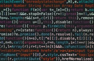 Close-up of colorful coding text on a dark computer screen, representing software development.